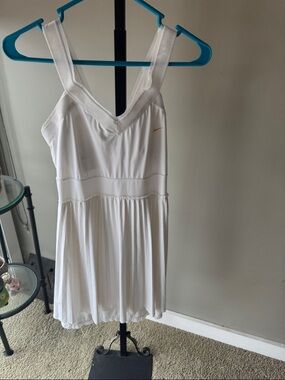 Nike White Tennis Dress with Gold Swoosh Accent
